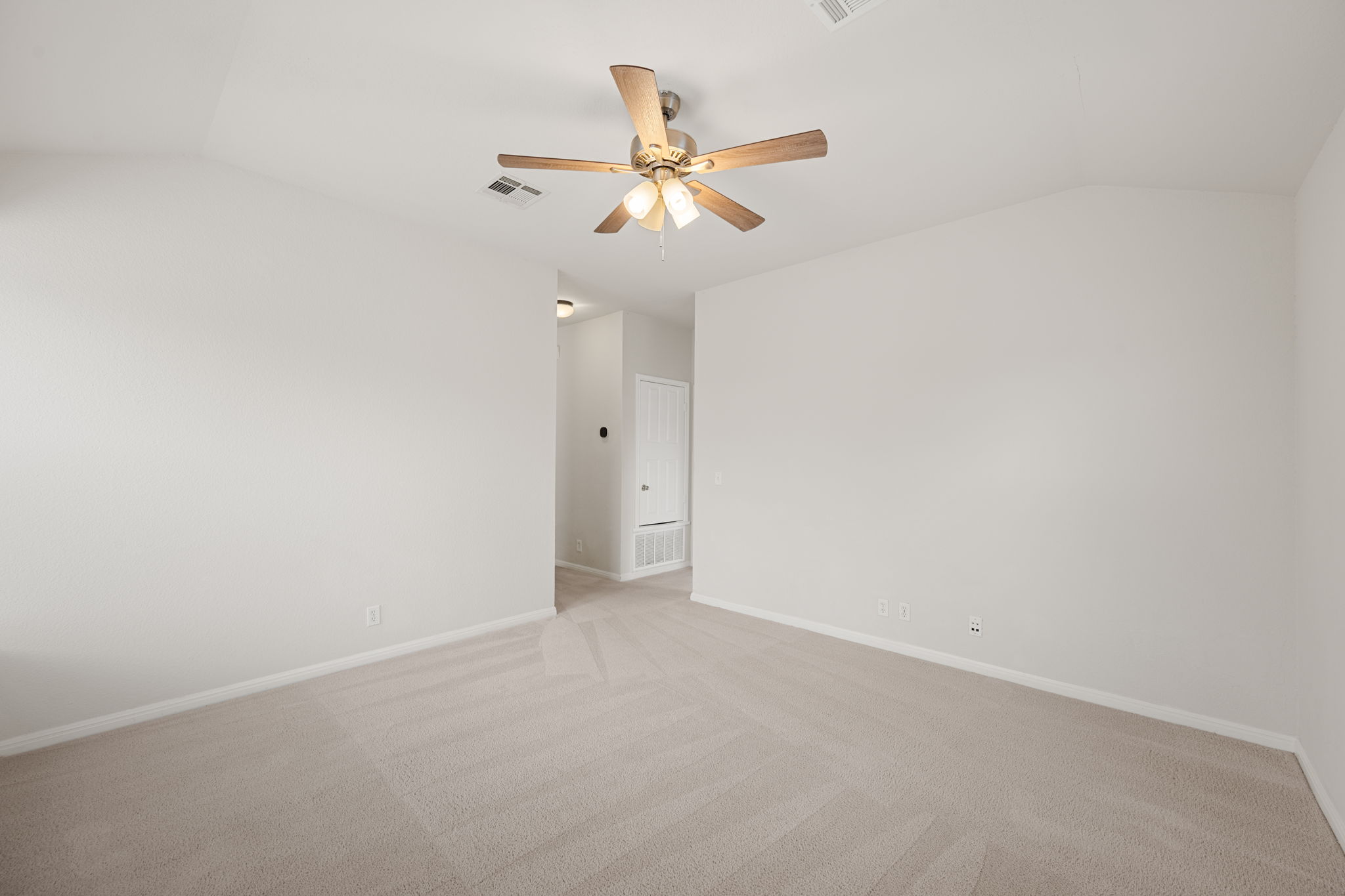 8902 Magna Carta Loop, Unit 122 Austin, TX 78754 - Photo 22 of 39 A spacious room offers comfortable carpeting, ready for personalization.