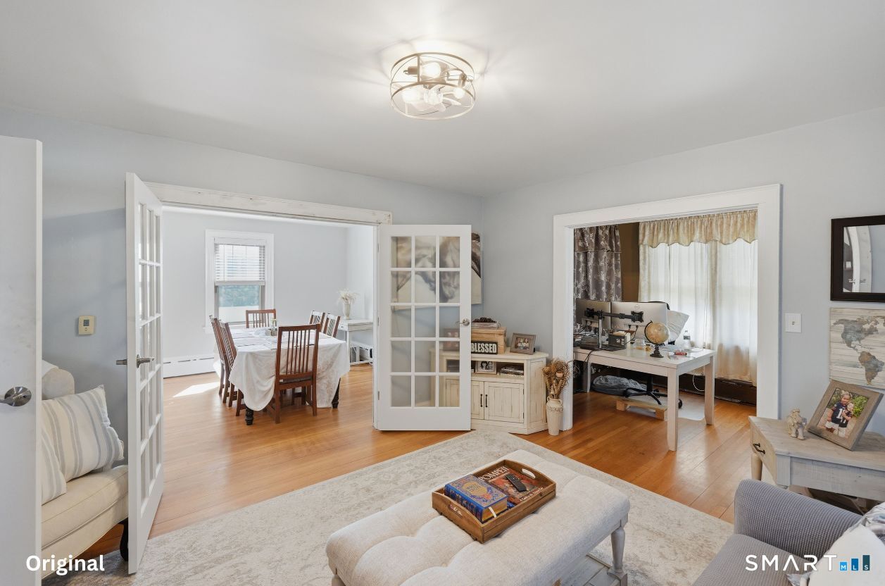 443 Highland Avenue Waterbury, CT 06708 - Photo 6 of 24 a living room with furniture and a table