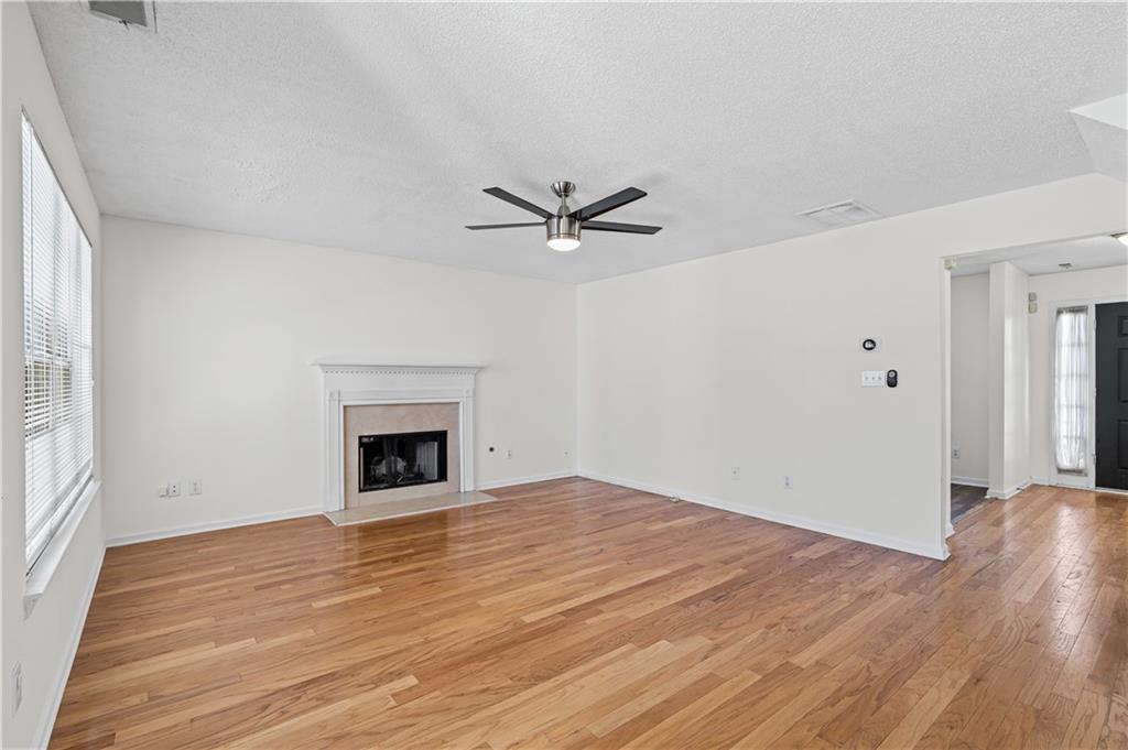 3550 Willow Tree Trace Decatur, GA 30034 - Photo 16 of 47 a view of an empty room with a window and a fireplace