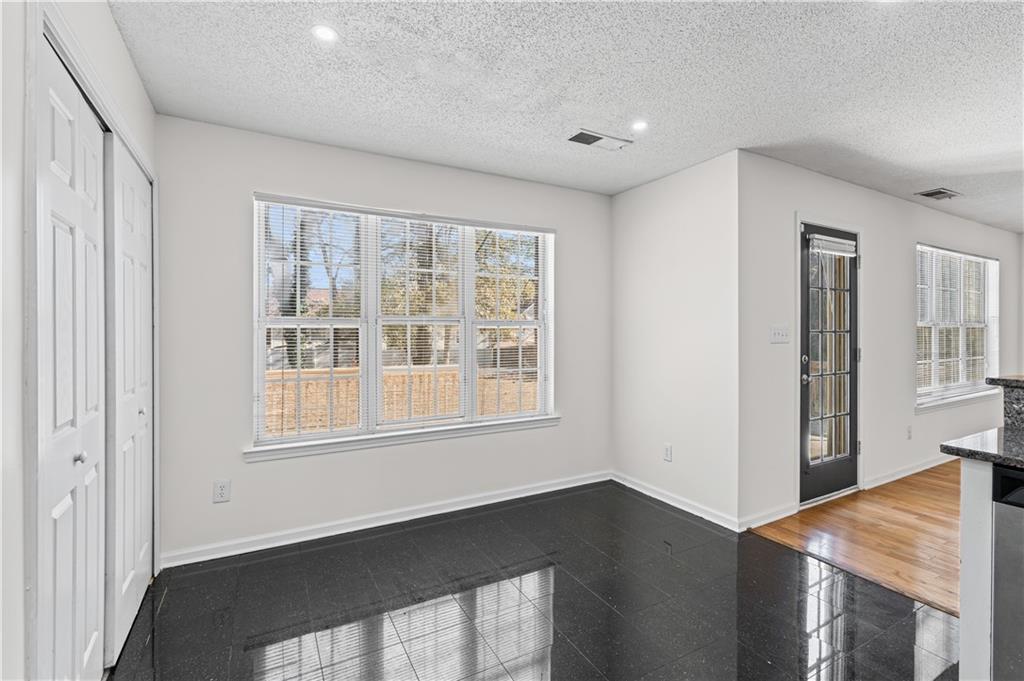 3550 Willow Tree Trace Decatur, GA 30034 - Photo 21 of 47 a view of an empty room with wooden floor and a window