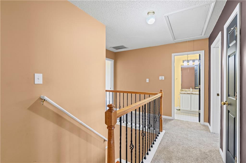 3550 Willow Tree Trace Decatur, GA 30034 - Photo 26 of 47 a view of a hallway with wooden floor and staircase