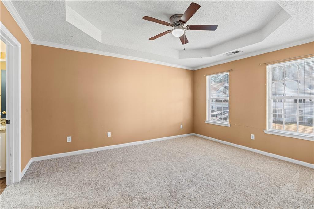 3550 Willow Tree Trace Decatur, GA 30034 - Photo 29 of 47 an empty room with windows and a ceiling fan