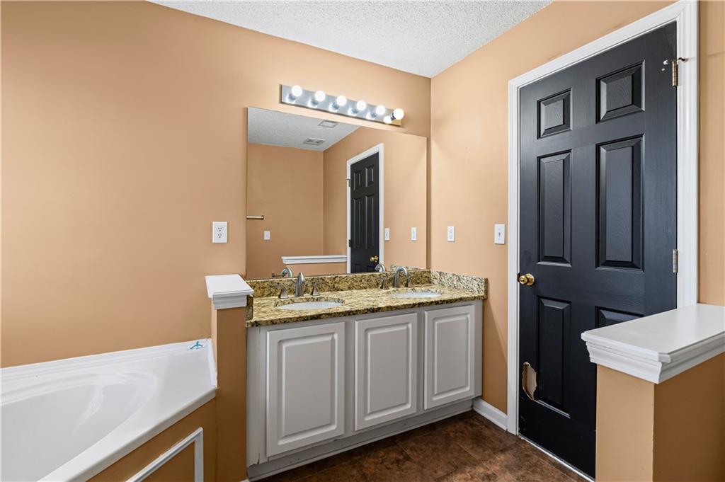 3550 Willow Tree Trace Decatur, GA 30034 - Photo 31 of 47 a bathroom with a granite countertop sink and a mirror