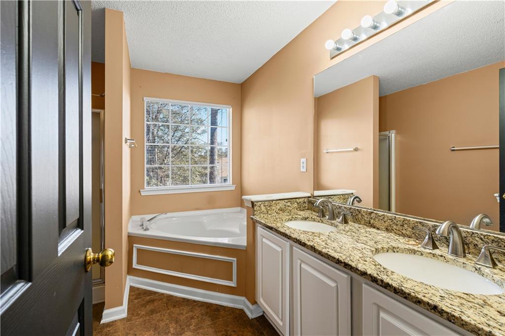 3550 Willow Tree Trace Decatur, GA 30034 - Photo 32 of 47 a bathroom with a granite countertop sink and a mirror