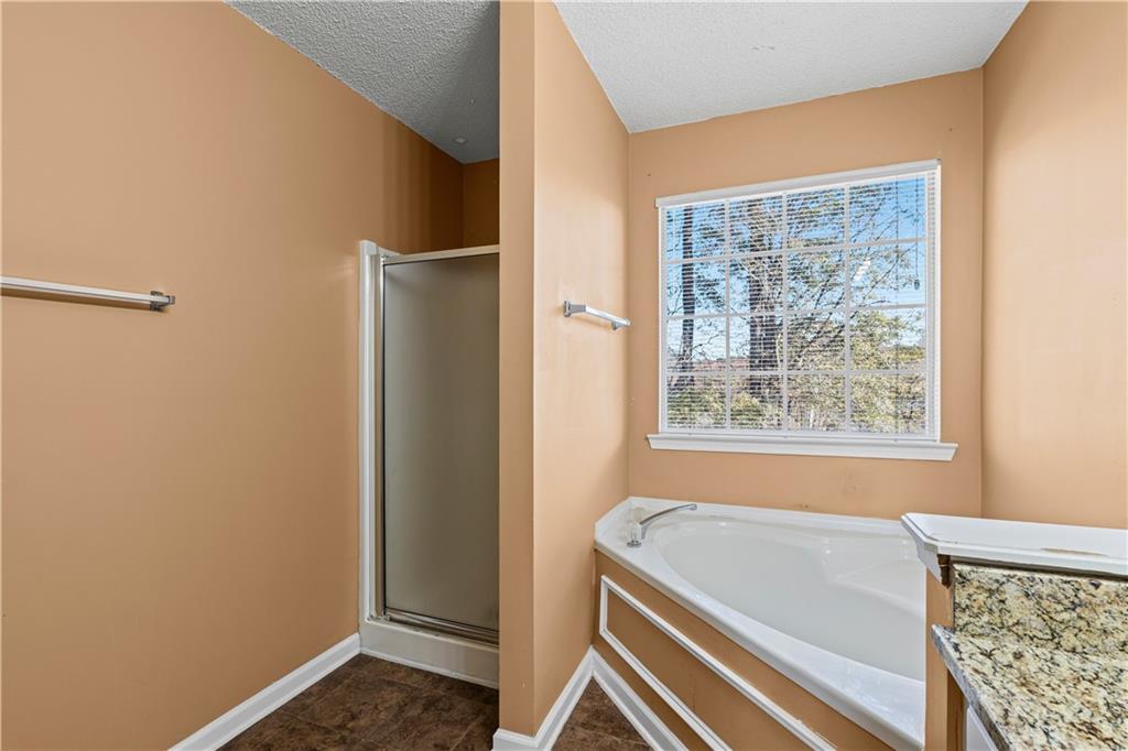 3550 Willow Tree Trace Decatur, GA 30034 - Photo 33 of 47 a bathroom with a bathtub and shower