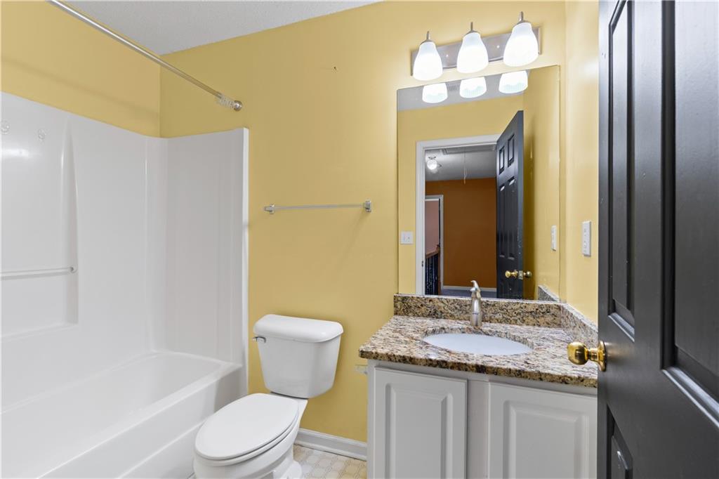 3550 Willow Tree Trace Decatur, GA 30034 - Photo 35 of 47 a bathroom with a granite countertop sink toilet and shower