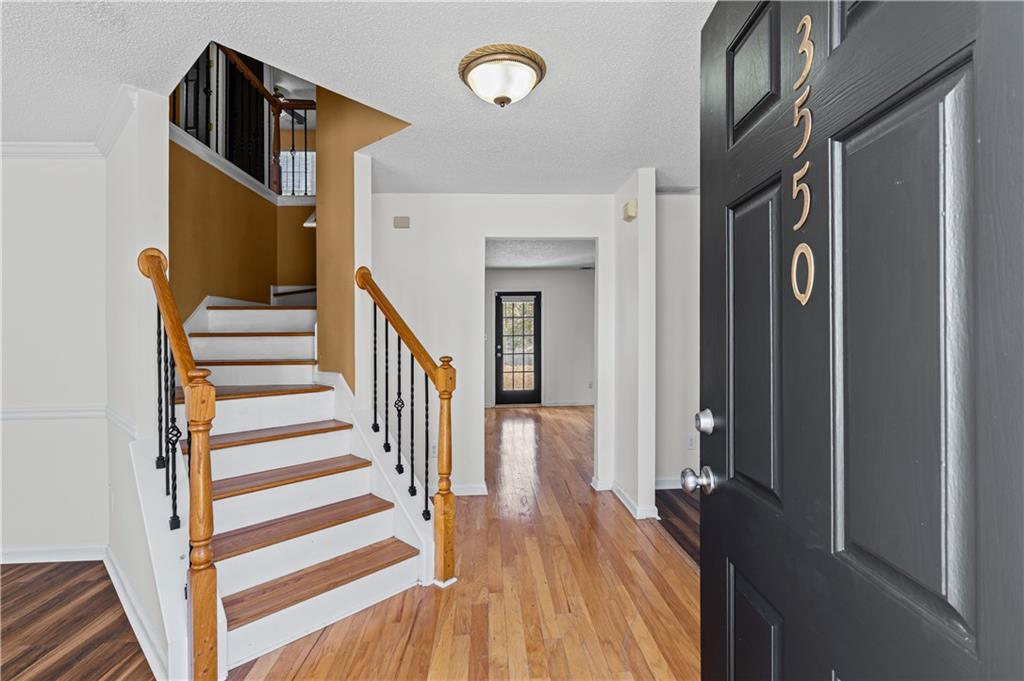 3550 Willow Tree Trace Decatur, GA 30034 - Photo 6 of 47 a view of a hallway with wooden floor and staircase