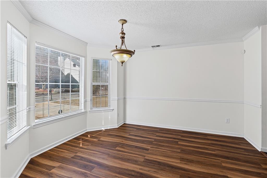 3550 Willow Tree Trace Decatur, GA 30034 - Photo 8 of 47 a view of empty room with wooden floor and fan