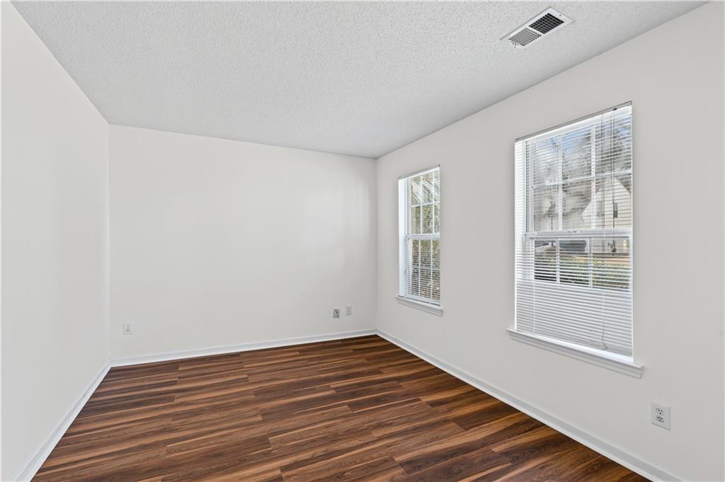 3550 Willow Tree Trace Decatur, GA 30034 - Photo 10 of 47 a view of empty room with wooden floor and fan