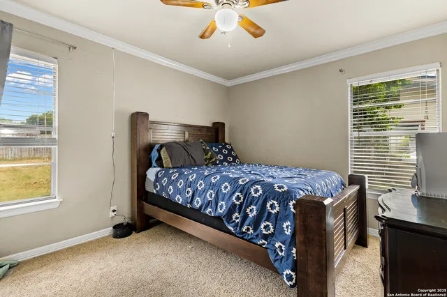 a bedroom with a bed and window