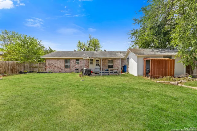 a front view of a house with a garden and porch