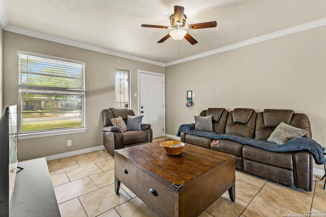 a living room with furniture and a window
