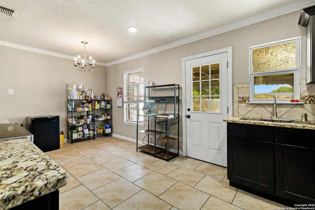a kitchen with refrigerator and cabinets