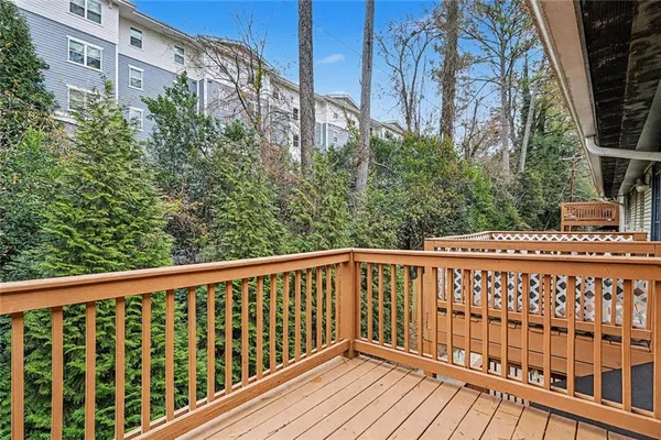 a view of a balcony with wooden floor