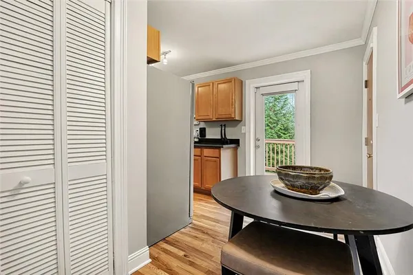 a dining room with furniture and window