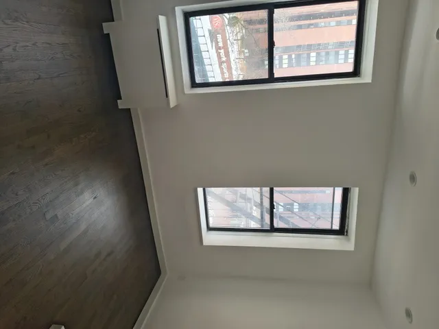 a view of a hallway with front door