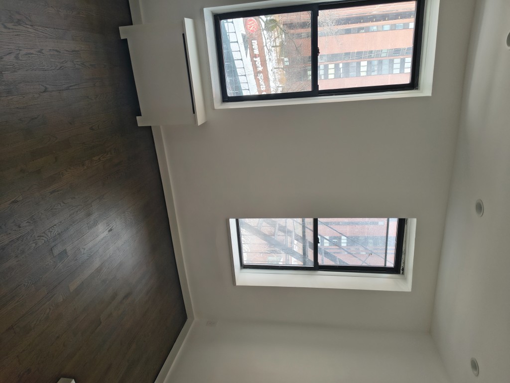 1628 3rd Avenue, Unit 4B Manhattan, NY 10128 - Photo 2 of 6 a view of a hallway with front door