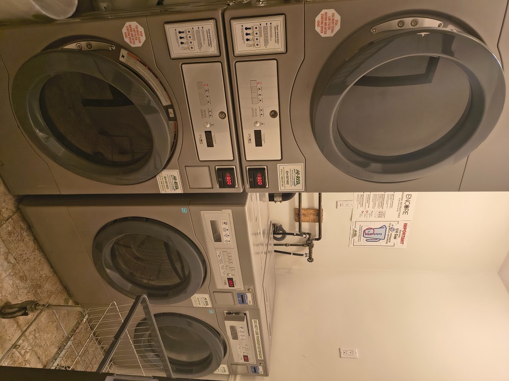 1628 3rd Avenue, Unit 4B Manhattan, NY 10128 - Photo 6 of 6 a utility room with dryer and washer