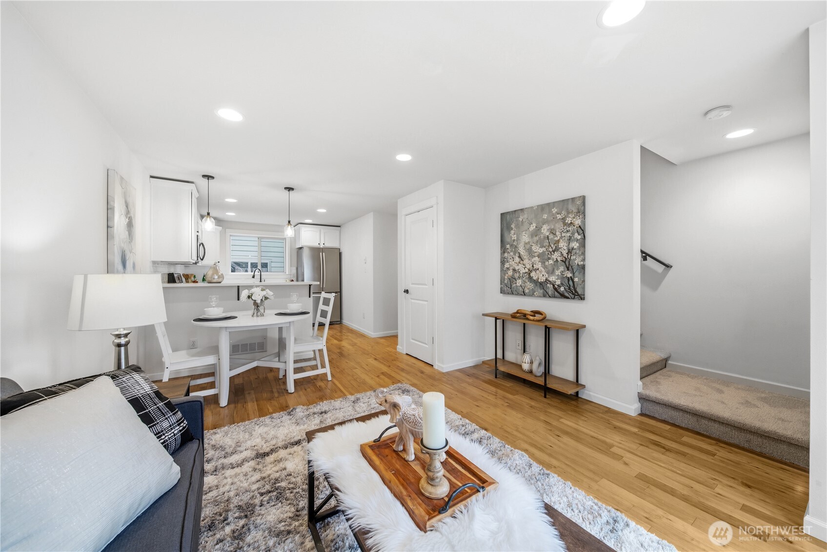1122 North 92nd Street, Unit B Seattle, WA 98103 - Photo 11 of 28 a living room with furniture and a table