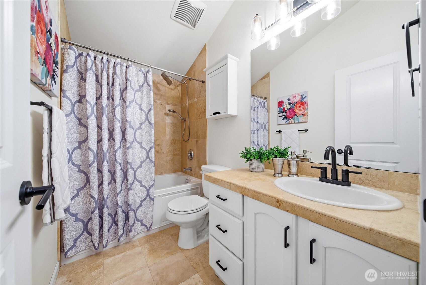 1122 North 92nd Street, Unit B Seattle, WA 98103 - Photo 17 of 28 a bathroom with a granite countertop sink and a mirror