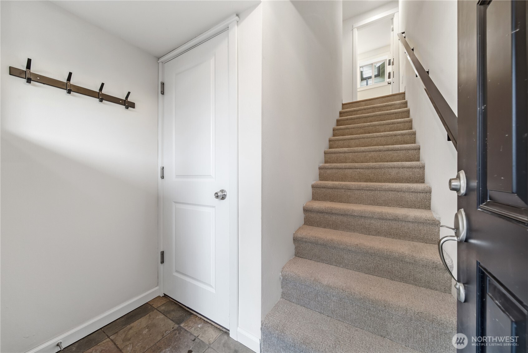 1122 North 92nd Street, Unit B Seattle, WA 98103 - Photo 3 of 28 a view of an entryway with staircase