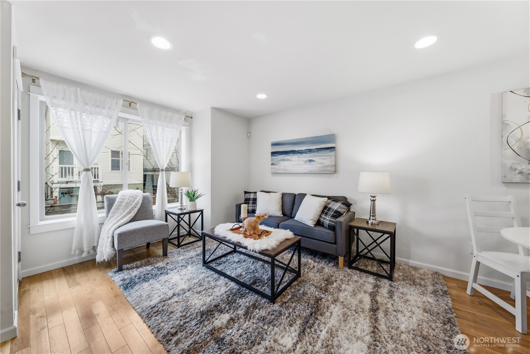 1122 North 92nd Street, Unit B Seattle, WA 98103 - Photo 8 of 28 a living room with furniture and a window