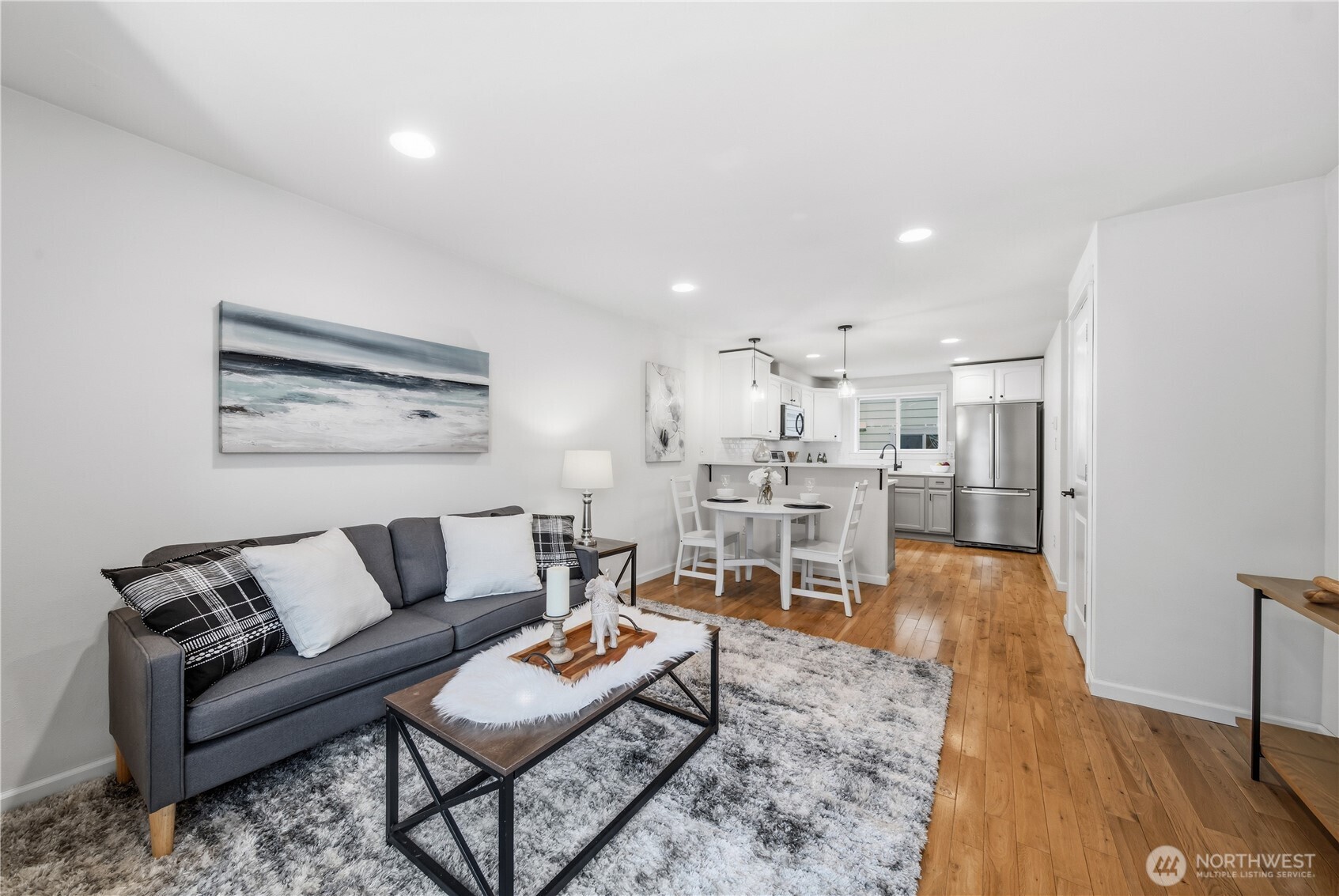 1122 North 92nd Street, Unit B Seattle, WA 98103 - Photo 10 of 28 a living room with furniture and view of kitchen