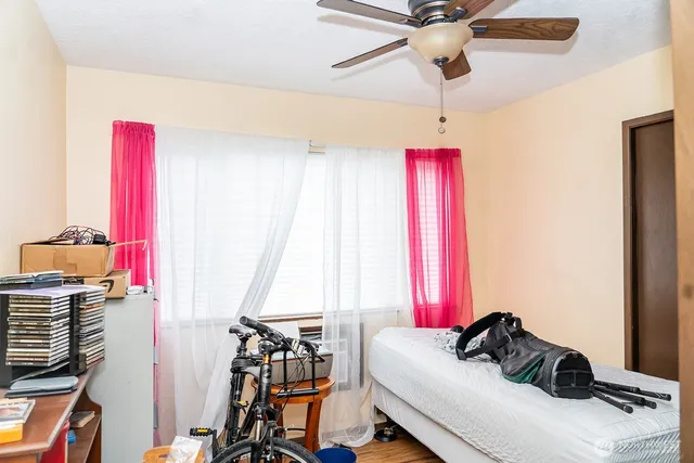 a bedroom with a bed and a window