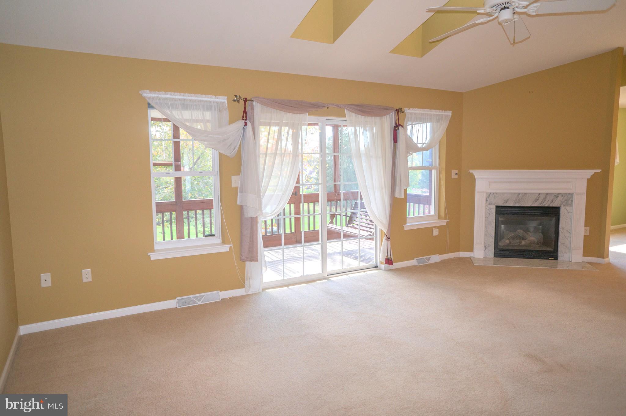 1221 Brighton Avenue Lititz, PA 17543 - Photo 15 of 57 a view of an empty room with a fireplace and a window