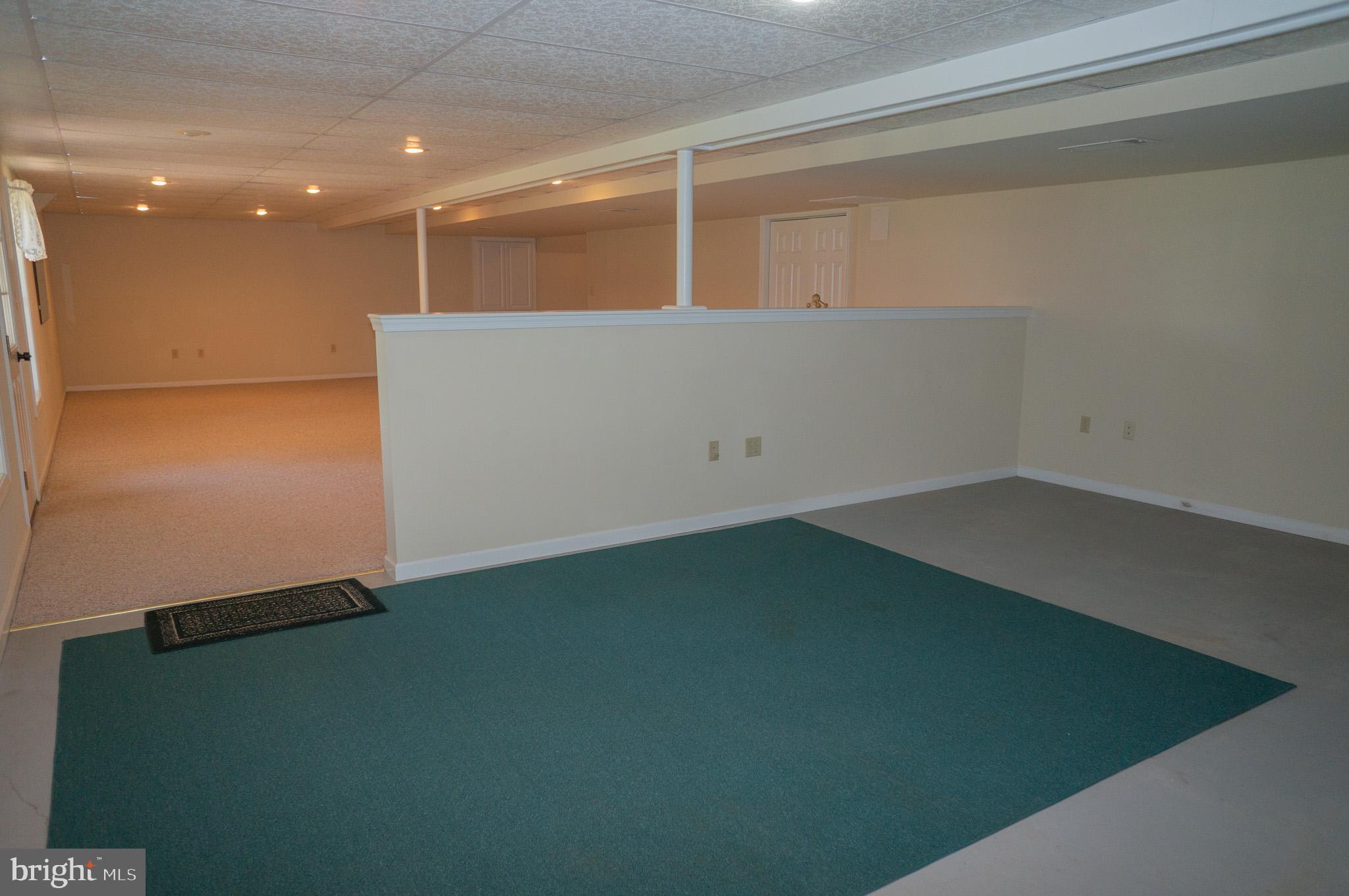 1221 Brighton Avenue Lititz, PA 17543 - Photo 39 of 57 an empty room with wooden floor and windows