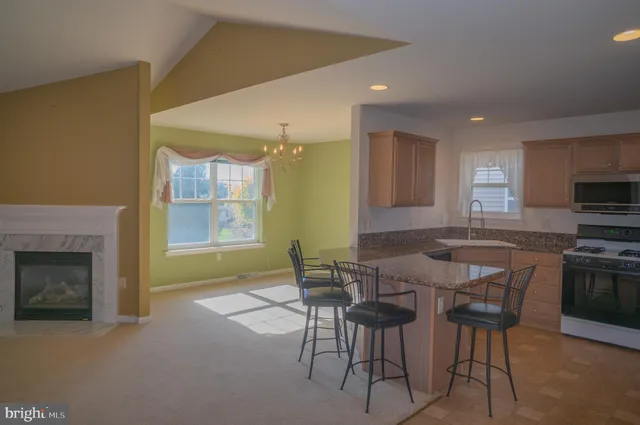 a kitchen with a stove a sink and a refrigerator