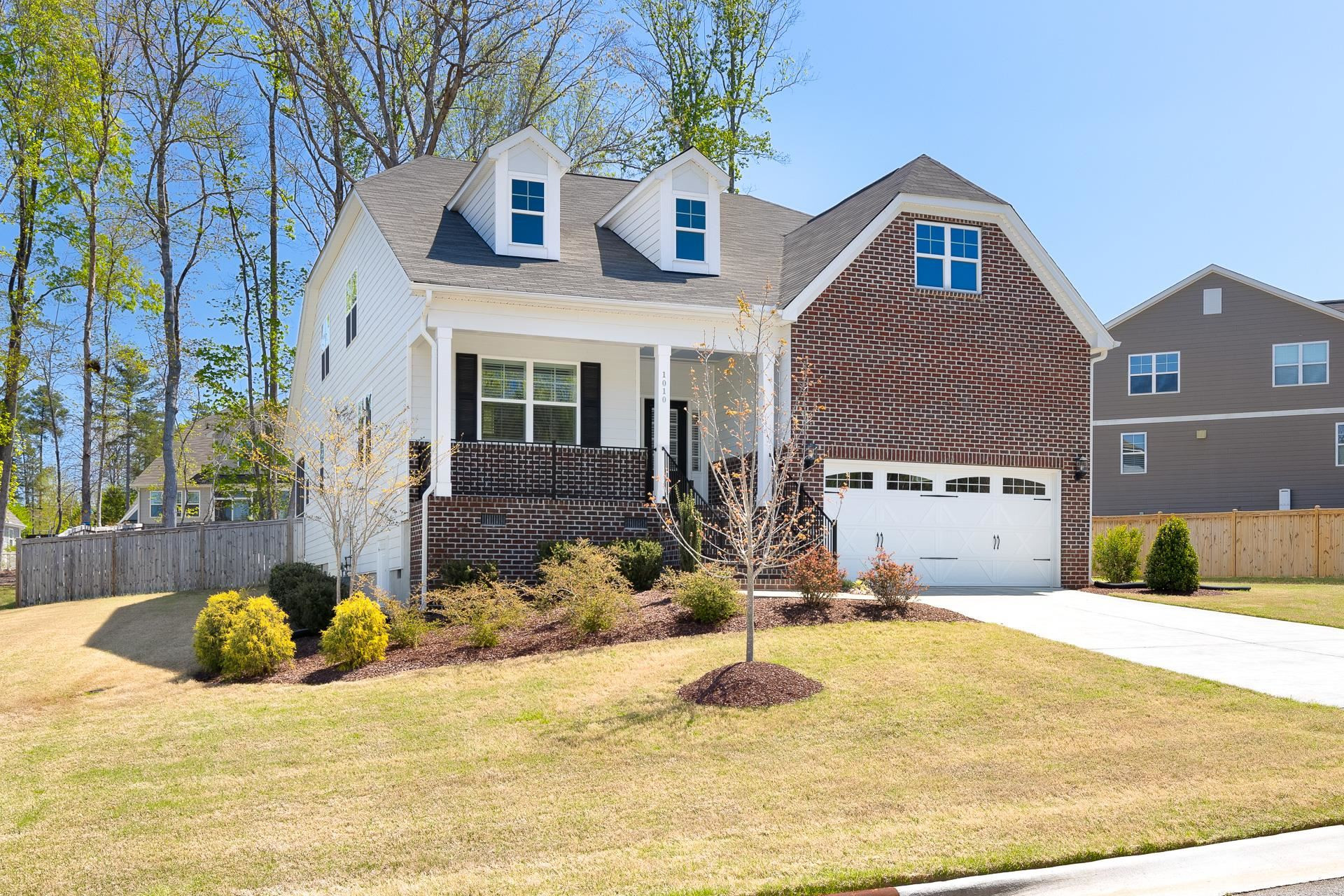 1010 Valley Rose Way Durham, NC 27712 - Photo 1 of 40 a view of a house with snow on the background