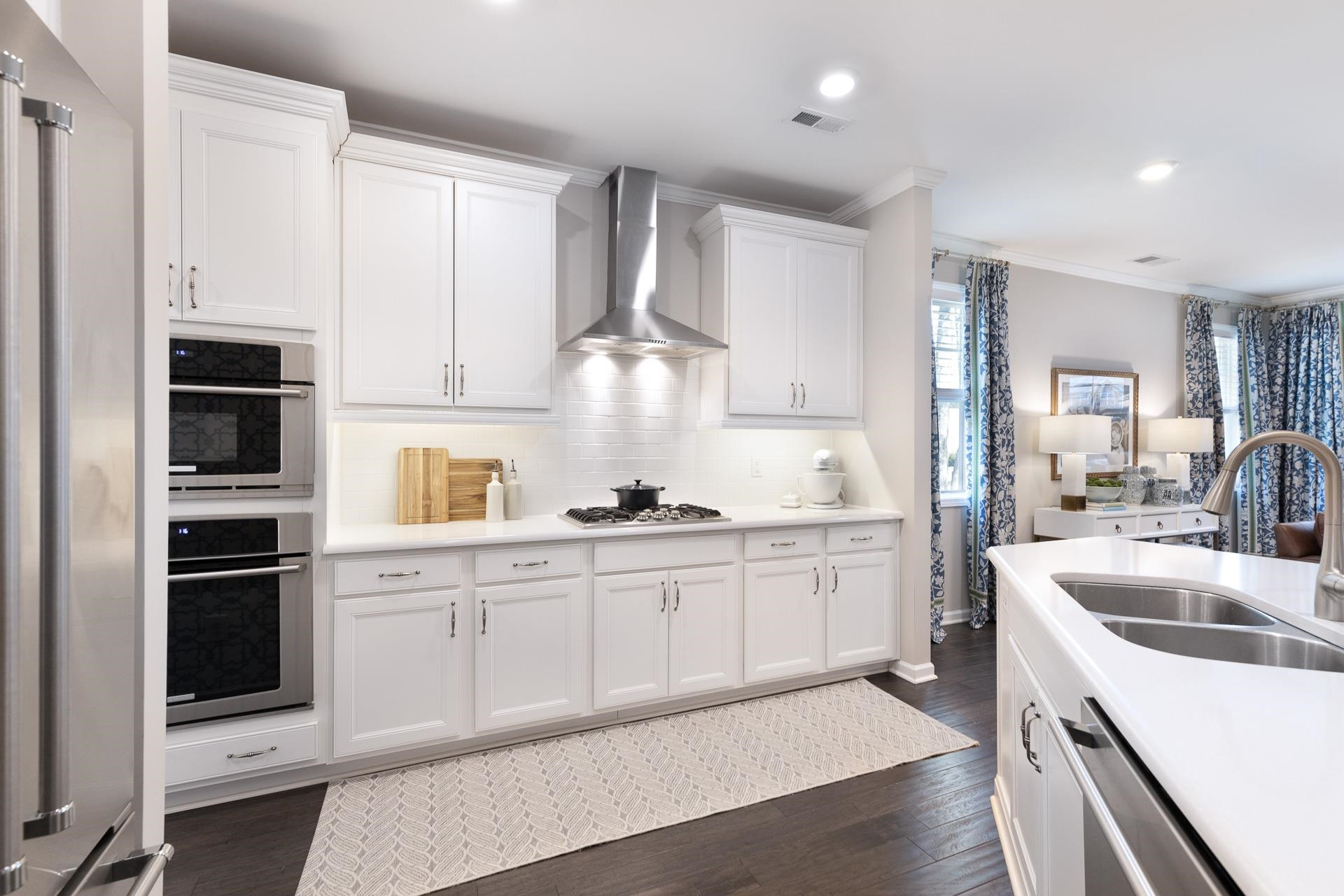 1010 Valley Rose Way Durham, NC 27712 - Photo 13 of 40 a kitchen with granite countertop a sink stainless steel appliances and cabinets