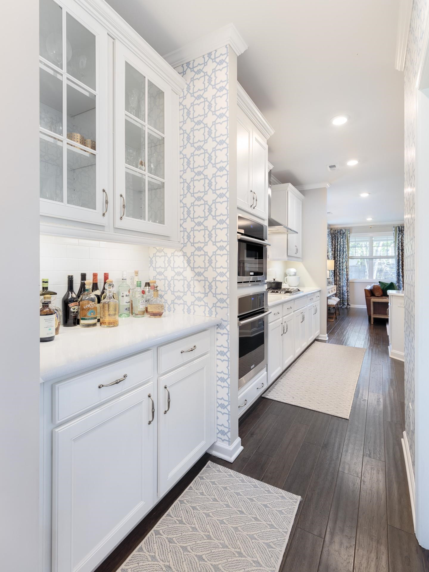 1010 Valley Rose Way Durham, NC 27712 - Photo 15 of 40 a kitchen with granite countertop white cabinets and white appliances