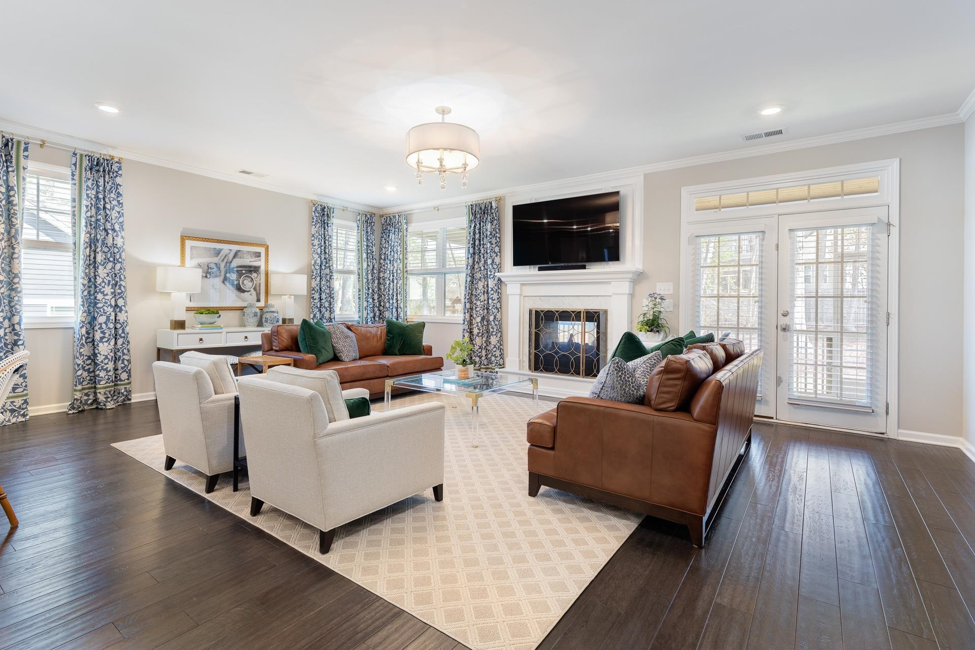 1010 Valley Rose Way Durham, NC 27712 - Photo 16 of 40 a living room with furniture a flat screen tv and a fireplace