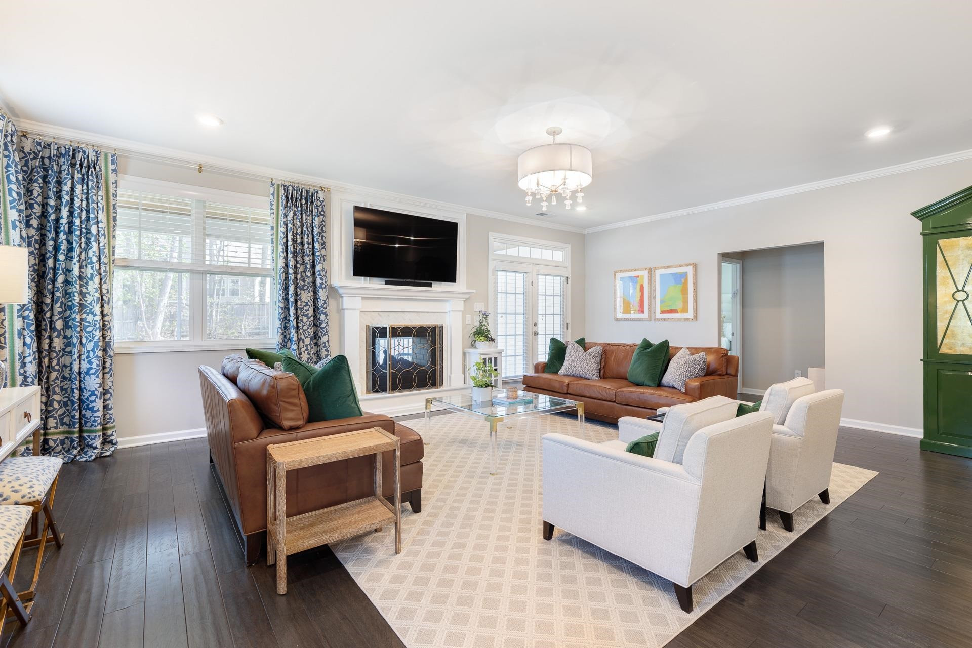 1010 Valley Rose Way Durham, NC 27712 - Photo 20 of 40 a living room with furniture a fireplace and a flat screen tv