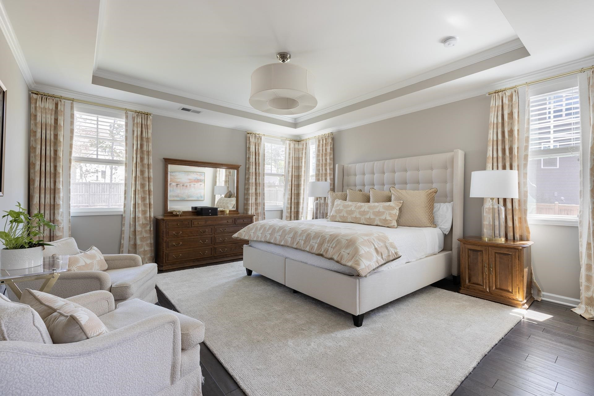 1010 Valley Rose Way Durham, NC 27712 - Photo 23 of 40 a bedroom with a bed couch and windows