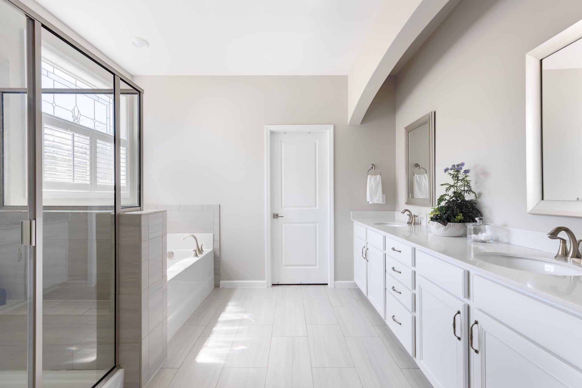 1010 Valley Rose Way Durham, NC 27712 - Photo 26 of 40 a bathroom with a double vanity sink and mirror
