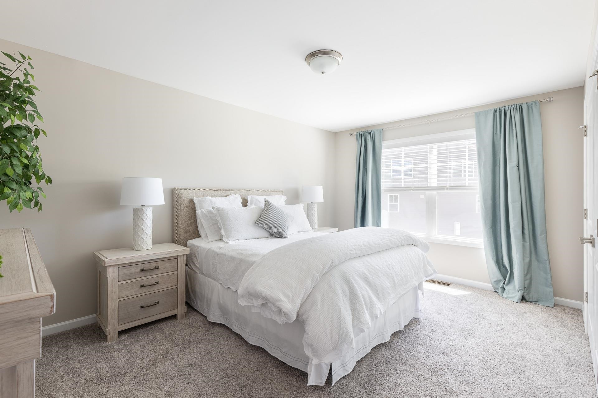 1010 Valley Rose Way Durham, NC 27712 - Photo 32 of 40 a spacious bedroom with a bed and a window