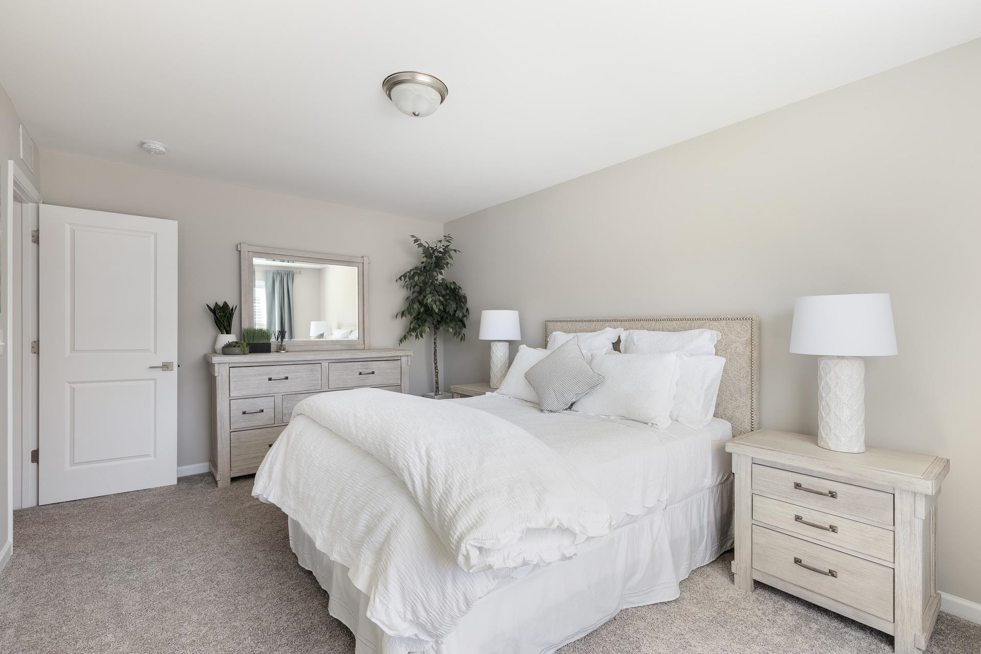 1010 Valley Rose Way Durham, NC 27712 - Photo 33 of 40 a bedroom with a bed and a lamp