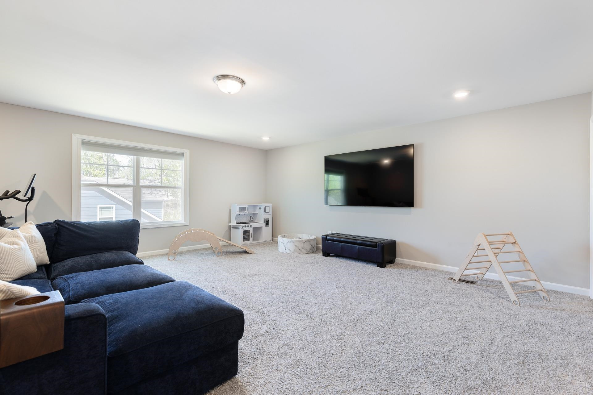 1010 Valley Rose Way Durham, NC 27712 - Photo 37 of 40 a living room with furniture and a flat screen tv