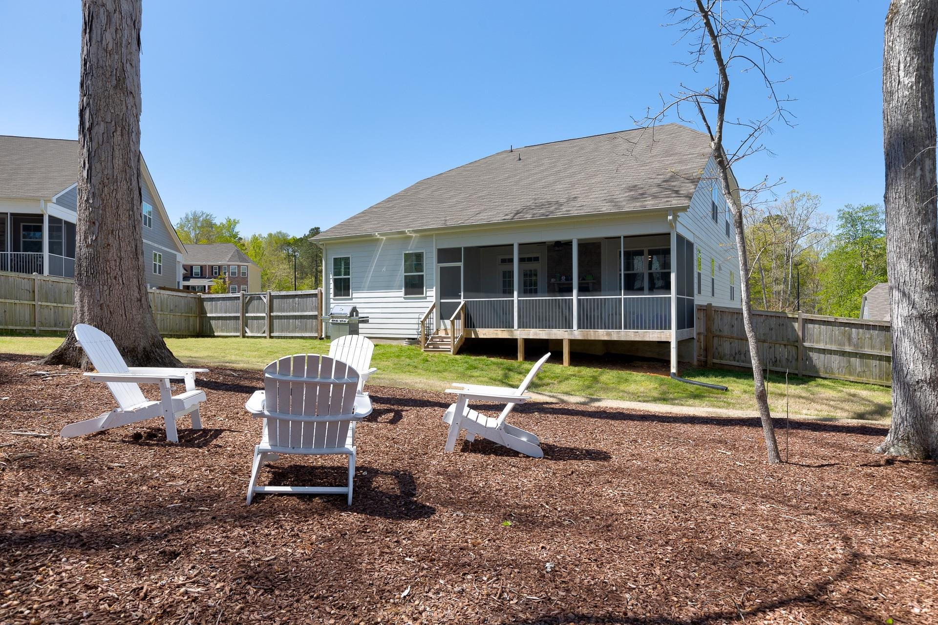 1010 Valley Rose Way Durham, NC 27712 - Photo 39 of 40 a view of backyard with wooden fence