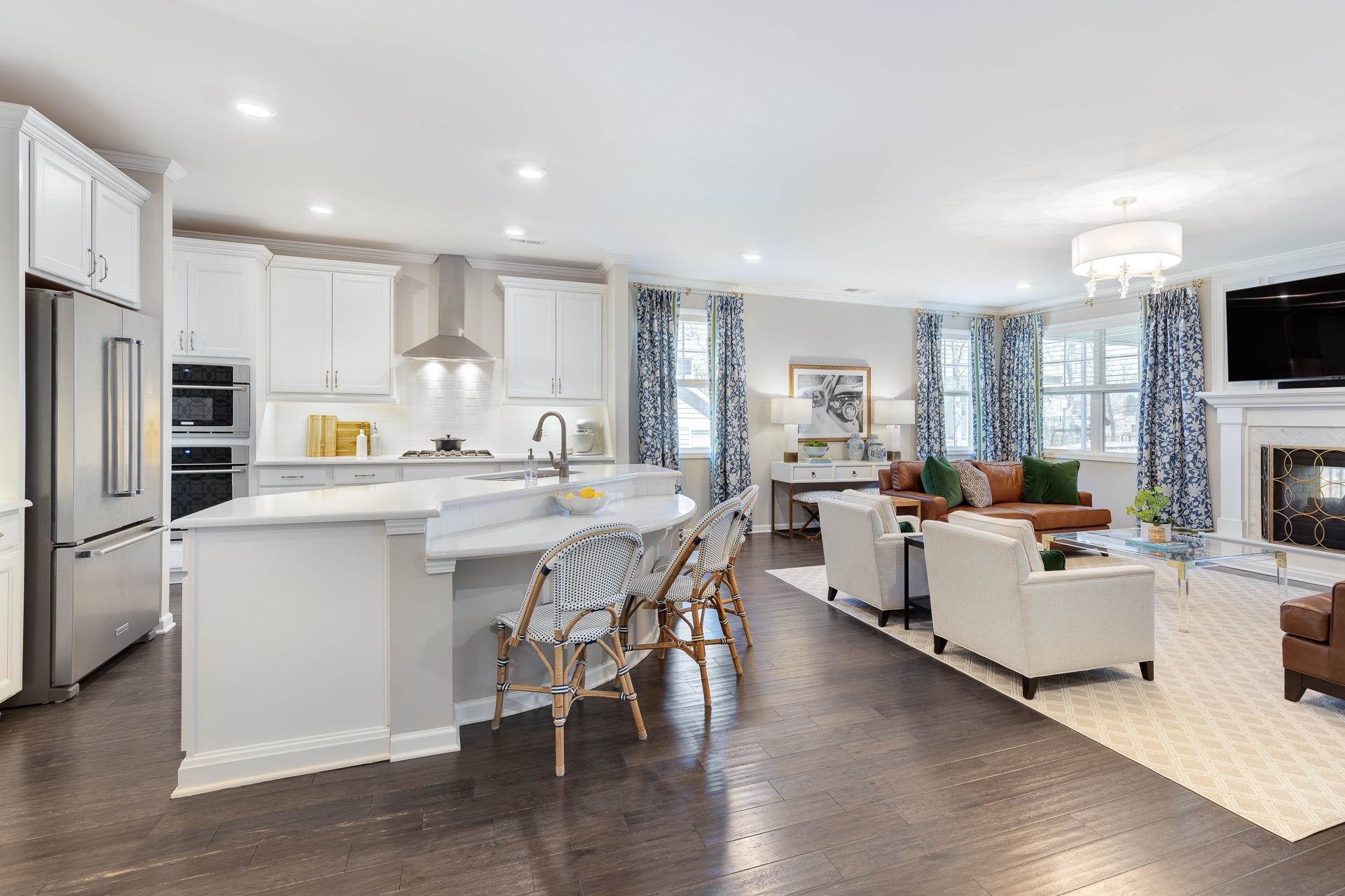 1010 Valley Rose Way Durham, NC 27712 - Photo 9 of 40 a kitchen with white cabinets and stainless steel appliances