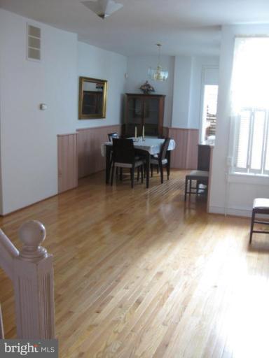 1409 Riverside Avenue Baltimore, MD 21230 - Photo 3 of 8 a living room with furniture and a flat screen tv