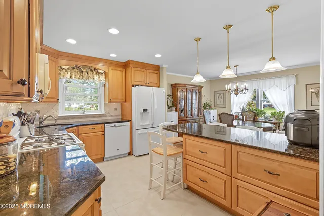 a kitchen with sink cabinets and refrigerator