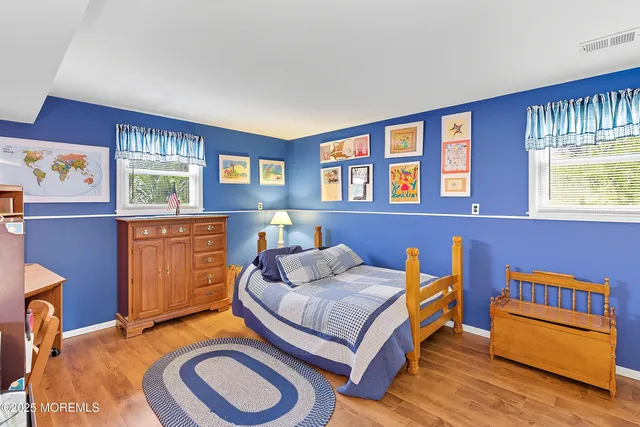 a bedroom with furniture and a window