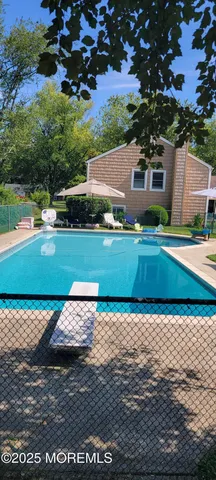 a view of a park with a large trees