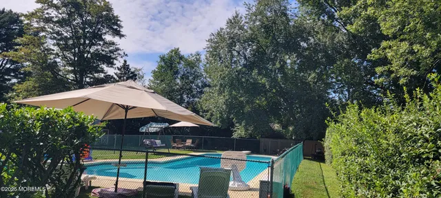 a view of swimming pool with a patio