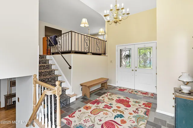 a view of an entryway with wooden floor