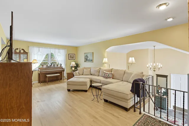 a living room with furniture fireplace and a table